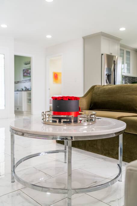 Spacious gathering room with an electric fireplace, AppleTV and Sound system