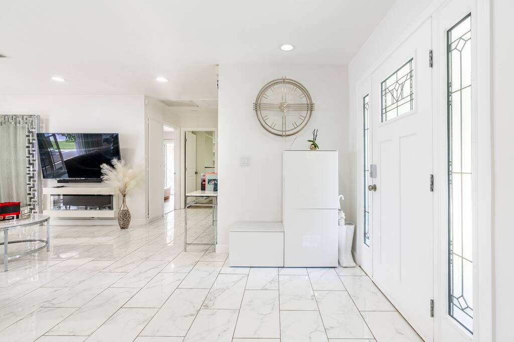Spacious gathering room with an electric fireplace, AppleTV and Sound system
