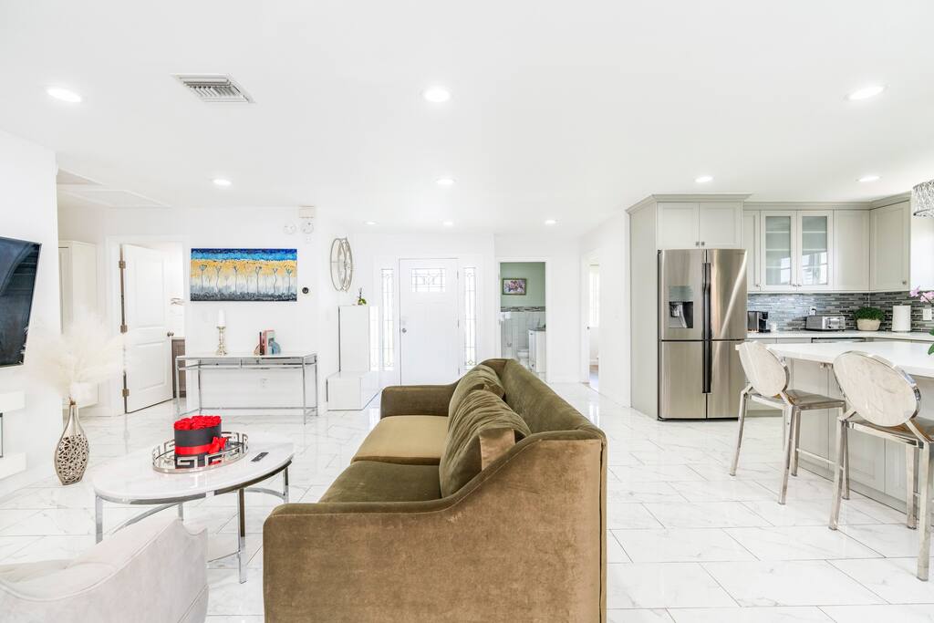 Spacious gathering room with an electric fireplace, AppleTV and Sound system