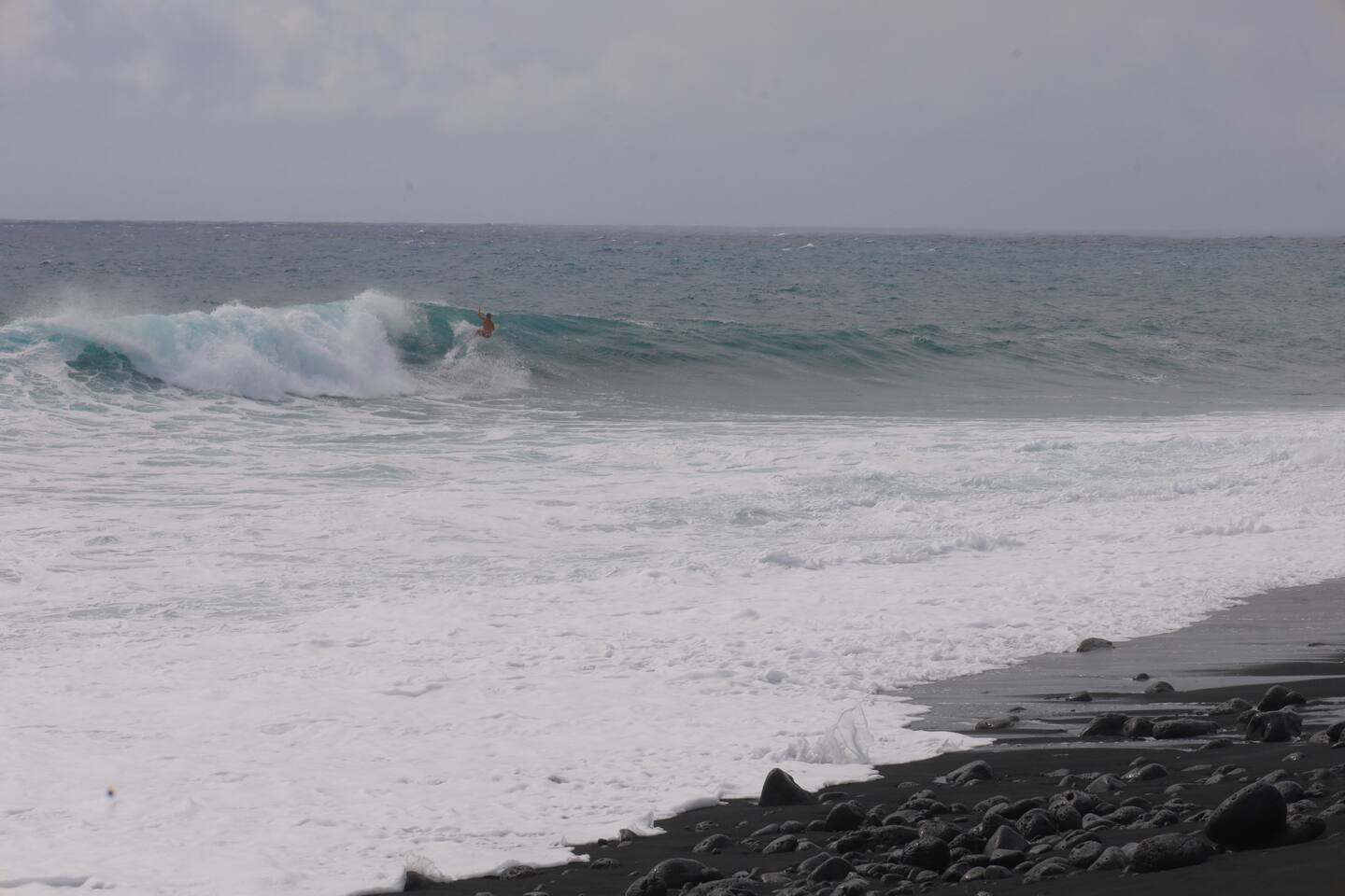 Surfing at Pohoiki Beach on the Puna coast