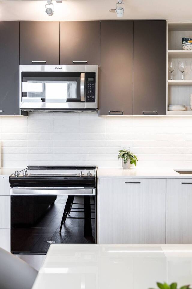 Elegant 4BR Condo with City Views & Free Parking